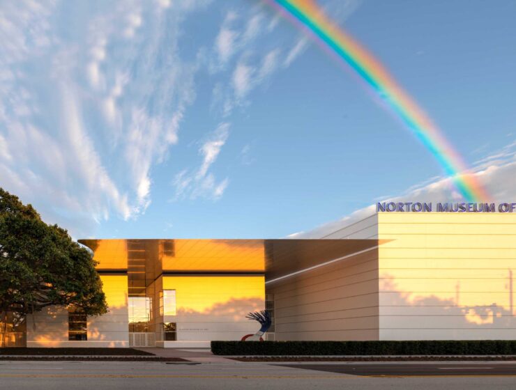 A picture of the Norton with a rainbow behind the building.